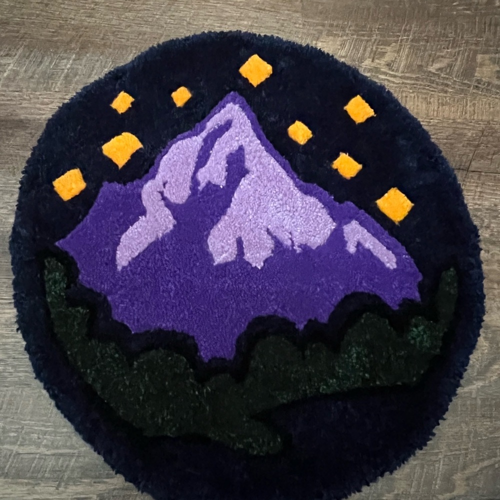 Round Mountain Rug with Purple and Yellow Accents